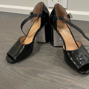 Marc Jacob’s black patent leather Mary Jane heels with rhinestone detail